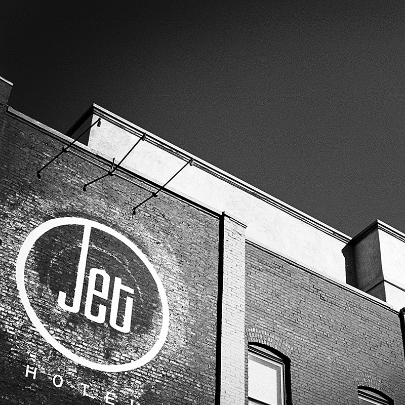 black and white jet contrail over the jet hotel